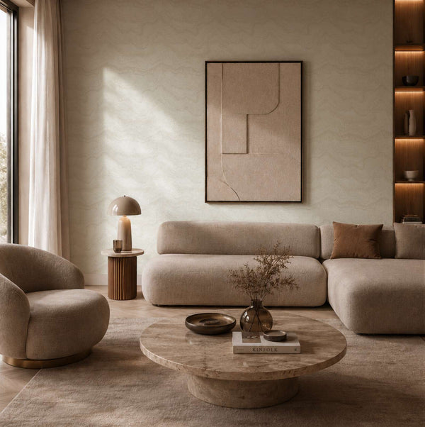 AS Creation Cosiness 793164 living room with Metallic, White wallpaper featuring a subtle wavy pattern, shown behind a sofa and a round coffee table.