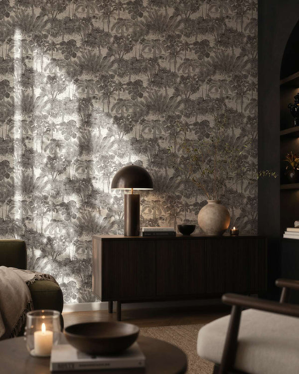 AS Creation Cosiness 793173 living room with Grey, Metallic wallpaper featuring a dense tropical foliage pattern, shown behind a sideboard and sofa.