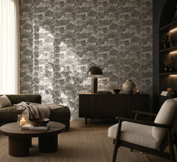 AS Creation Cosiness 793173 living room featuring Grey, Metallic botanical wallpaper with palm trees behind a sofa and sideboard.