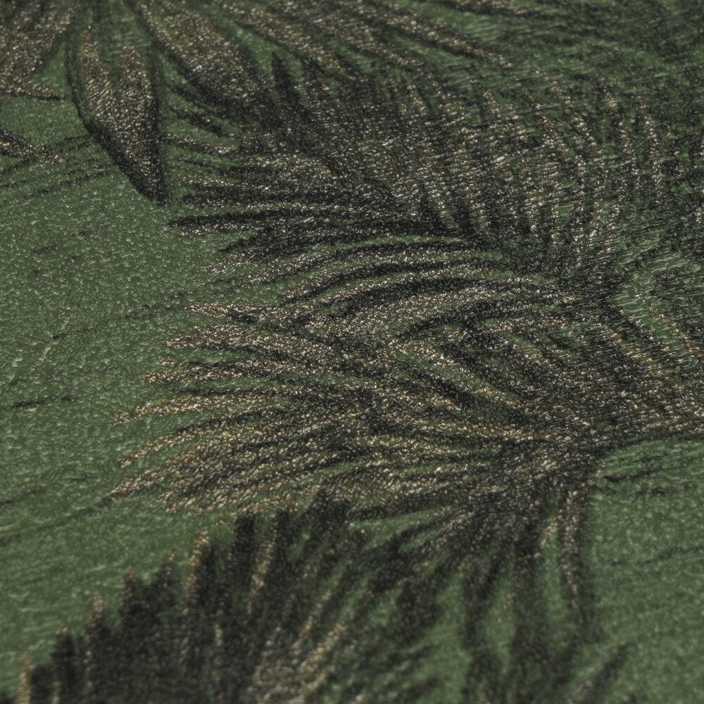 AS Creation Cosiness 793175 close up of wallpaper showing palm frond pattern with a metallic sheen in the Green, Metallic colorway and a textured surface.