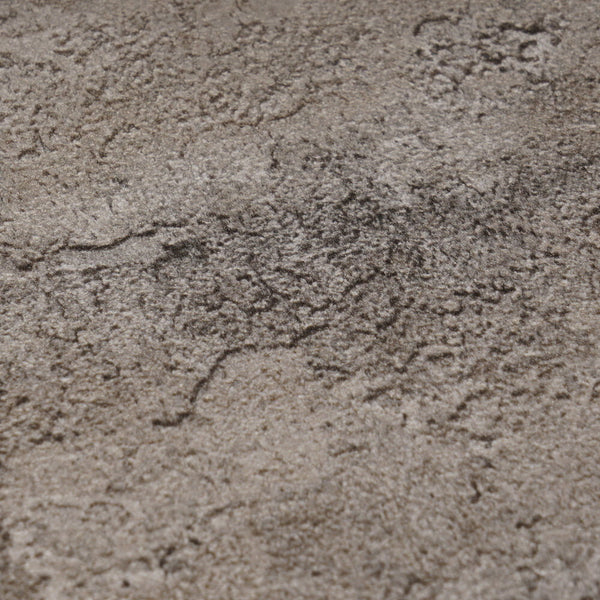 AS Creation Cosiness 793181 close up of wallpaper showing a mottled, stone like pattern in Brown and Grey with Metallic tones.