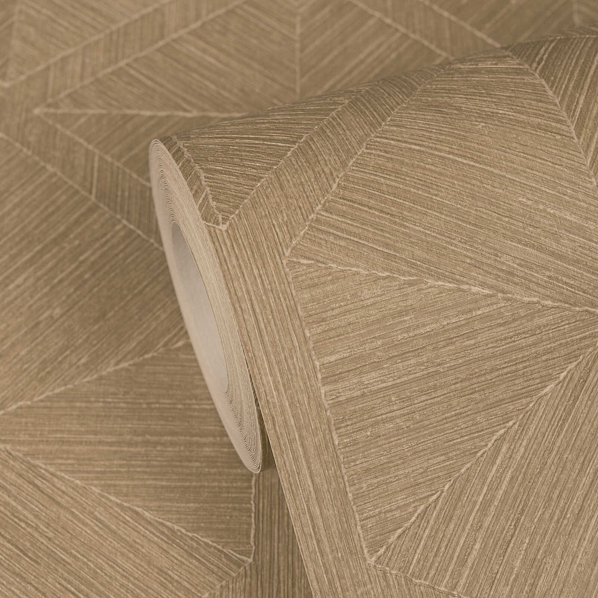 AS Creation Cosiness 793195 beige, Brown geometric wallpaper roll on a matching unrolled sheet, showing large triangular and chevron forms with fine parallel linework.