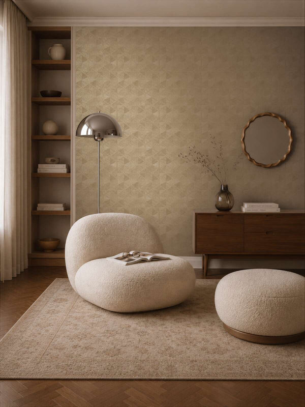 AS Creation Cosiness 793195 beige, Brown geometric triangle pattern wallpaper in a living room with a lounge chair and floor lamp.