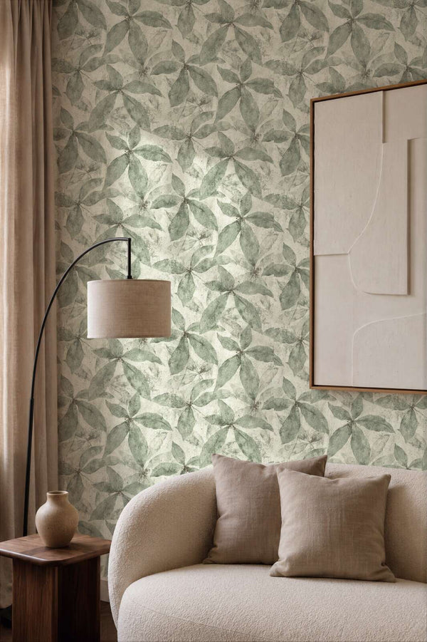 AS Creation Cosiness 793202 living room with Cream, Green leaf pattern wallpaper, a curved sofa and a floor lamp.