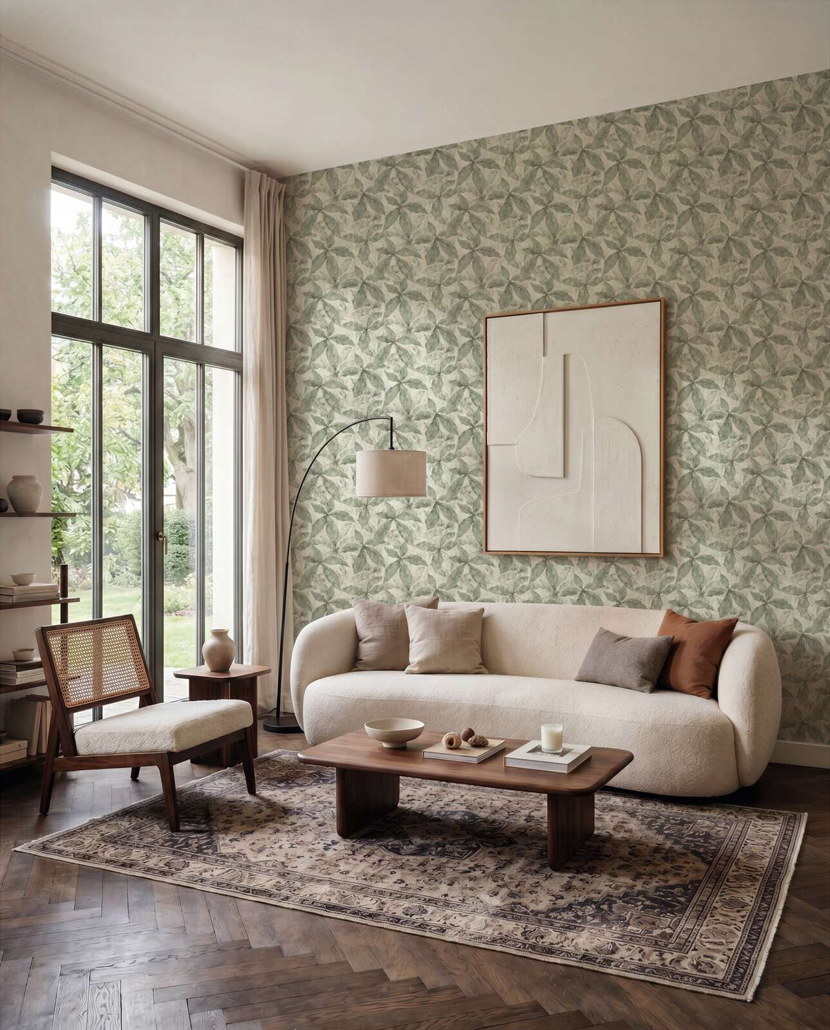 AS Creation Cosiness 793202 repeating leaf like geometric pattern in Cream and Green wallpaper on a living room feature wall.