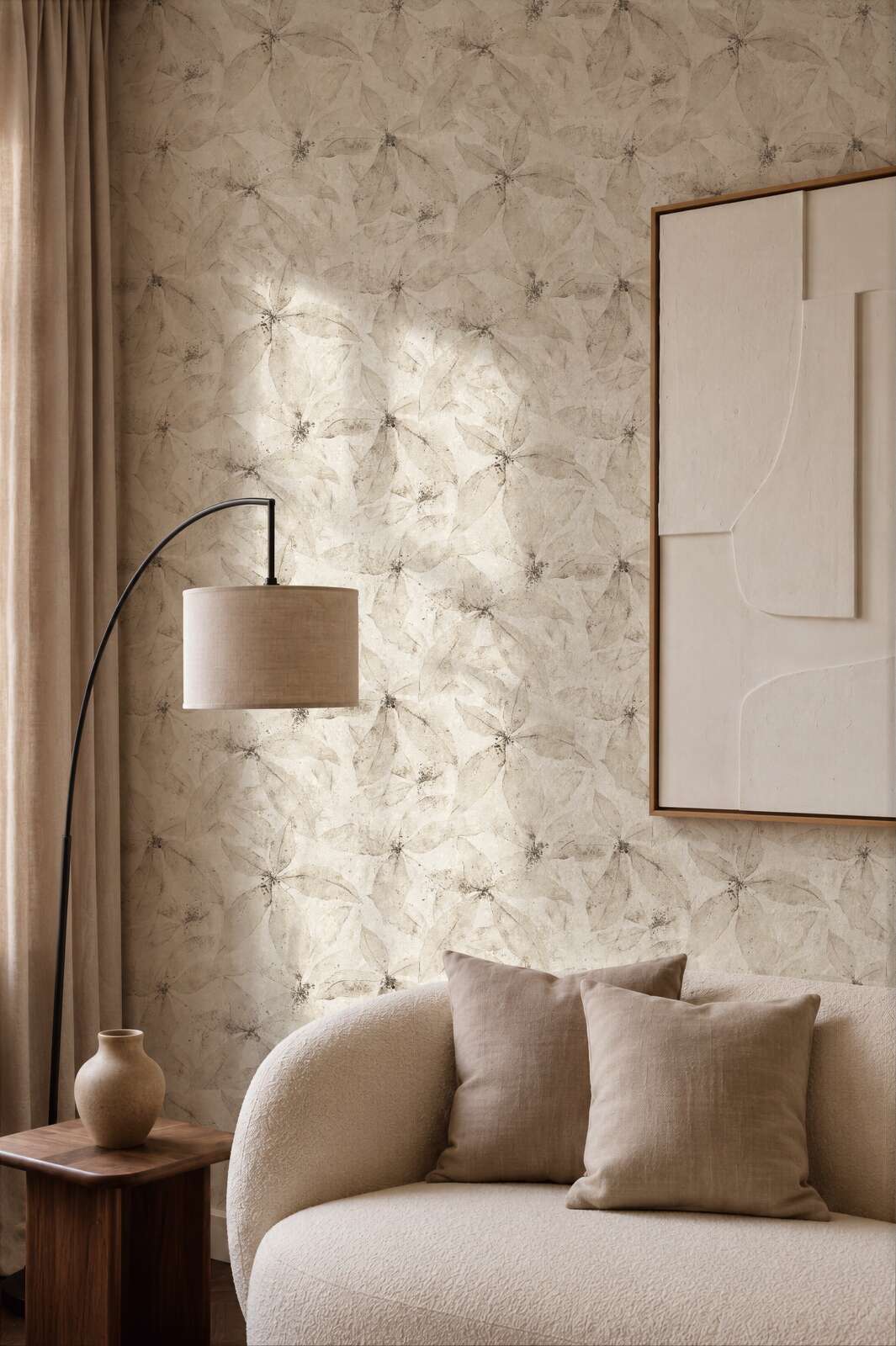AS Creation Cosiness 793204 living room with Beige, Cream wallpaper featuring a layered petal pattern, shown behind a curved sofa and a floor lamp.