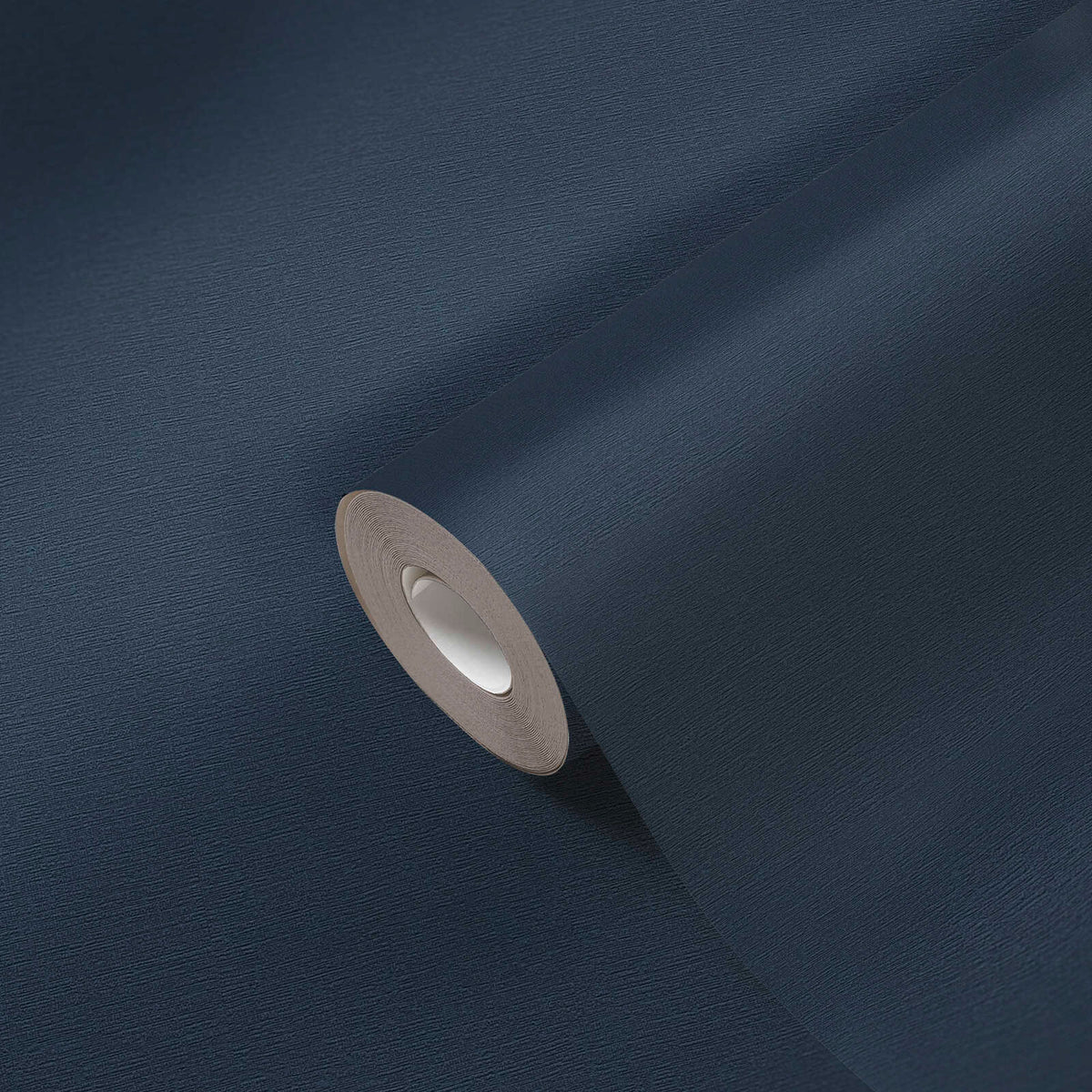 AS Creation French Affair 356536 blue wallpaper roll shown close up on a matching unrolled sheet, revealing a fine textured surface.