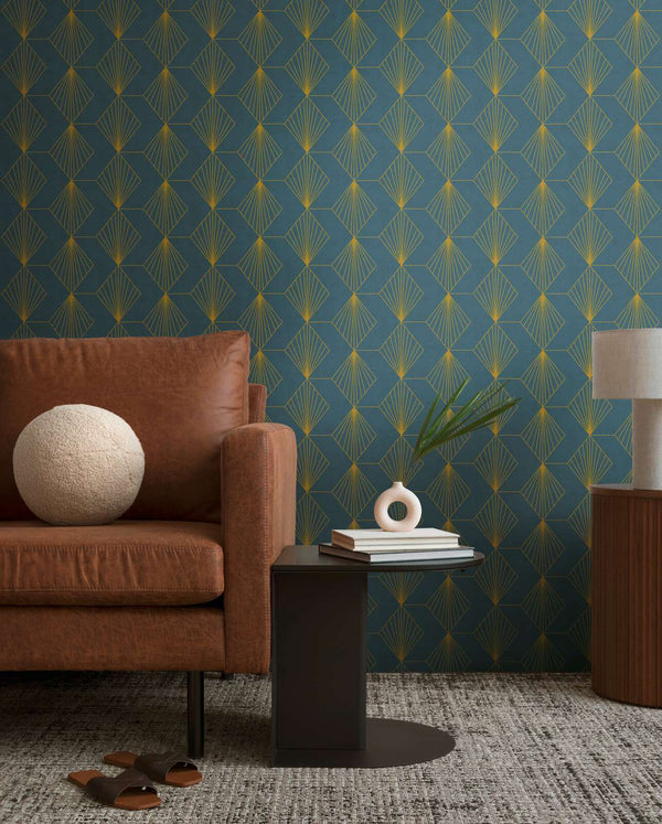 AS Creation French Affair 361561 living room with Blue, Metallic geometric fan wallpaper behind a leather sofa and a small side table.