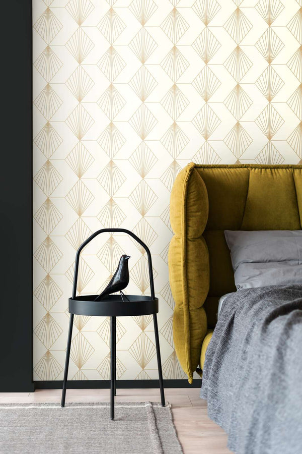 AS Creation French Affair 367101 bedroom with Cream, Metallic geometric fan pattern wallpaper behind an upholstered bed and a small black side table.