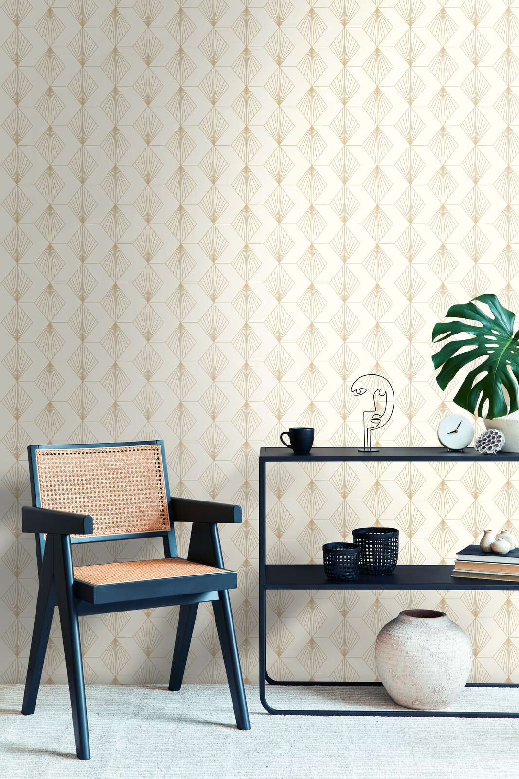 AS Creation French Affair 367101 living room with cream and metallic geometric fan wallpaper behind a chair and a console table.