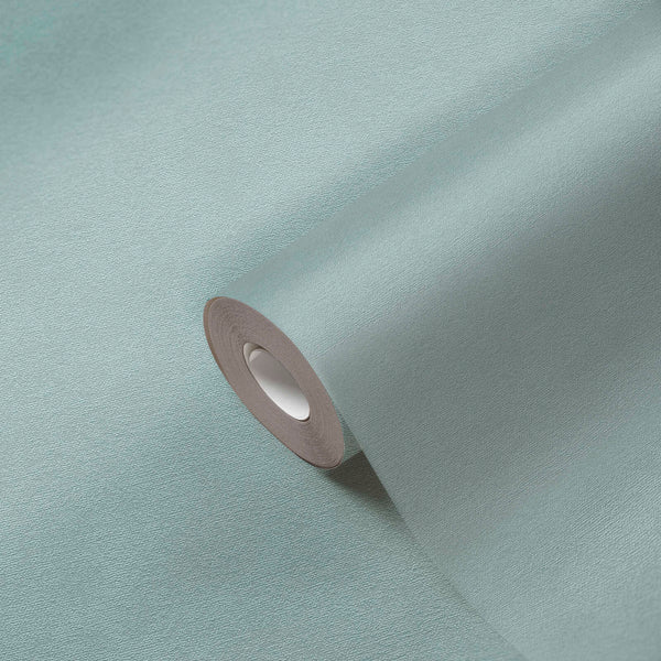 AS Creation French Affair 393418 textured wallpaper roll in the Blue, Green, Turquoise colorway, partially unrolled on a matching surface.