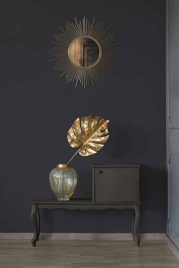 AS Creation French Affair 395726 entryway with Black wallpaper behind a console table and a round sunburst mirror.