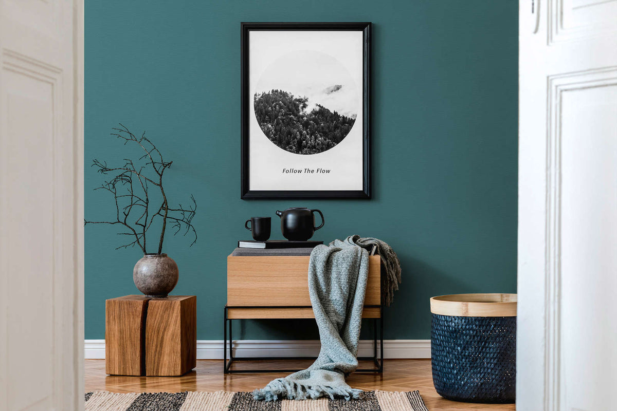 AS Creation French Affair 395764 living room with Blue, Green wallpaper behind a wooden console and framed wall art.