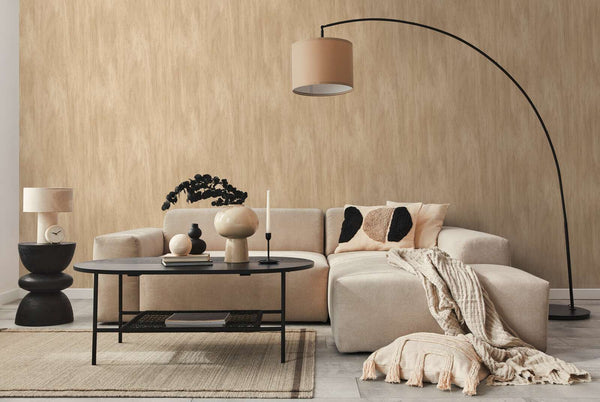 AS Creation French Affair 398012 living room with Beige wallpaper behind a sectional sofa and an arc floor lamp.