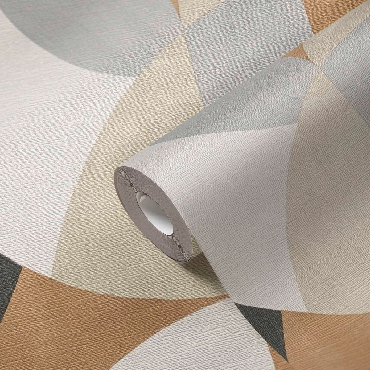 AS Creation French Affair 399321 close up product view of a wallpaper roll on matching surface, showing abstract overlapping geometric shapes in Beige, Black, Brown, Cream, and Grey.