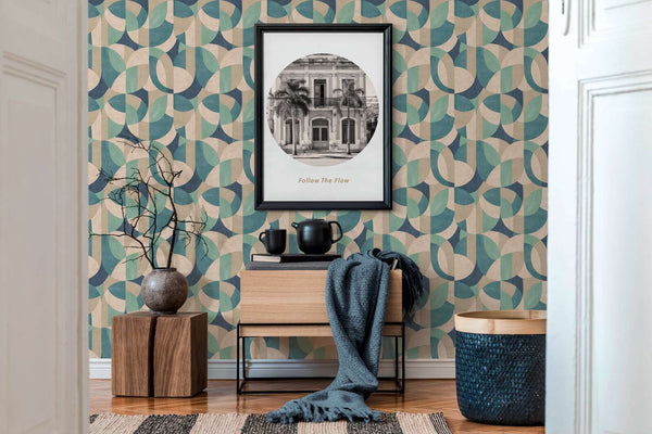 AS Creation French Affair 399322 a living room with geometric Beige, Blue, Cream, Green, and Turquoise wallpaper behind a framed wall art and a wood console.