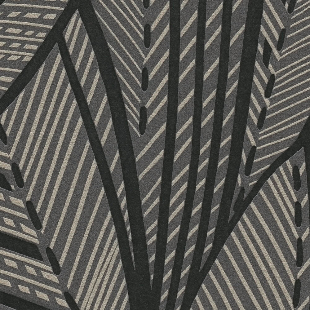 AS Creation French Affair 399334 close up of wallpaper showing a bold leaf motif with diagonal stripes and dotted accents in Black and Gold Metallic.