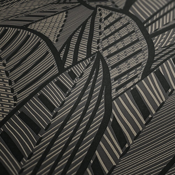 AS Creation French Affair 399334 close up of wallpaper showing a black and metallic gold striped geometric leaf pattern.