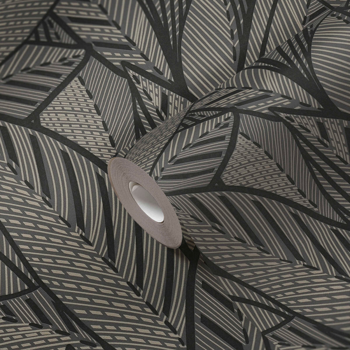 AS Creation French Affair 399334 wallpaper roll on matching surface showing a graphic leaf pattern in Black, Gold, Metallic.
