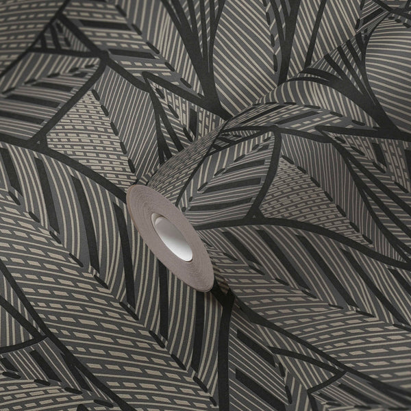 AS Creation French Affair 399334 wallpaper roll on matching surface showing a graphic leaf pattern in Black, Gold, Metallic.