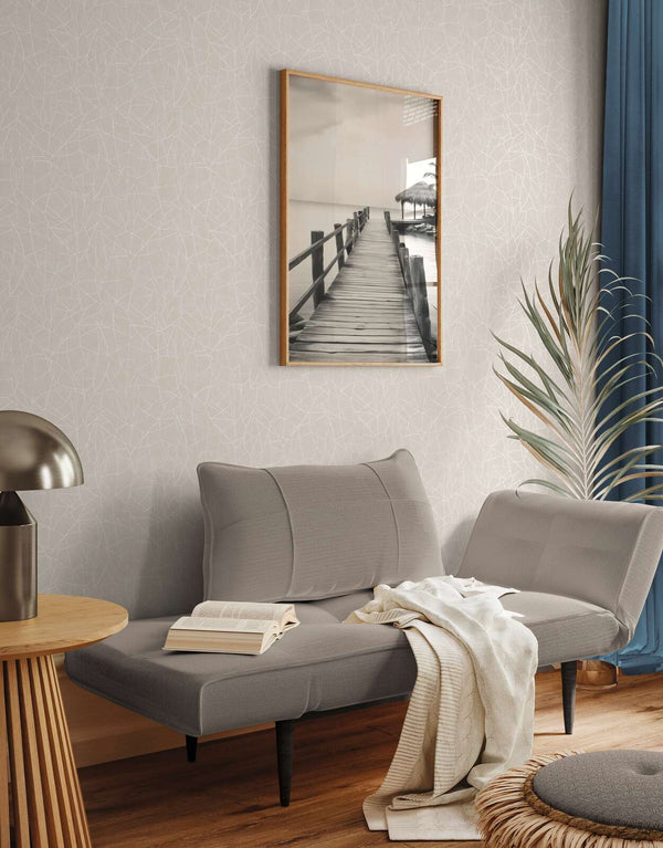 AS Creation French Affair 399341 living room with Grey, White wallpaper in an abstract line pattern behind a sofa and framed wall art.