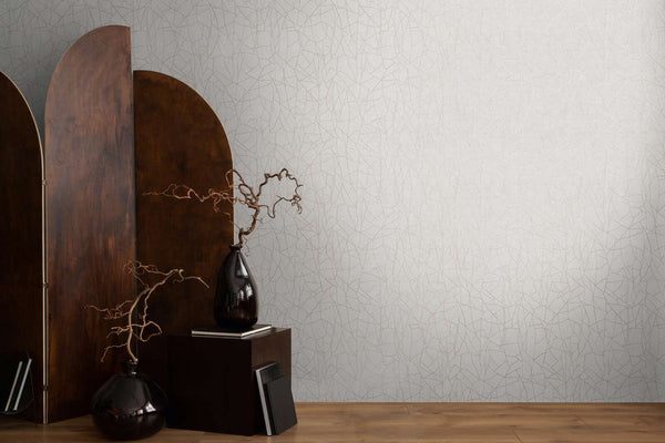 AS Creation French Affair 399341 grey and White wallpaper with a fine abstract line pattern, shown with a wood room divider and a dark vase on a pedestal.