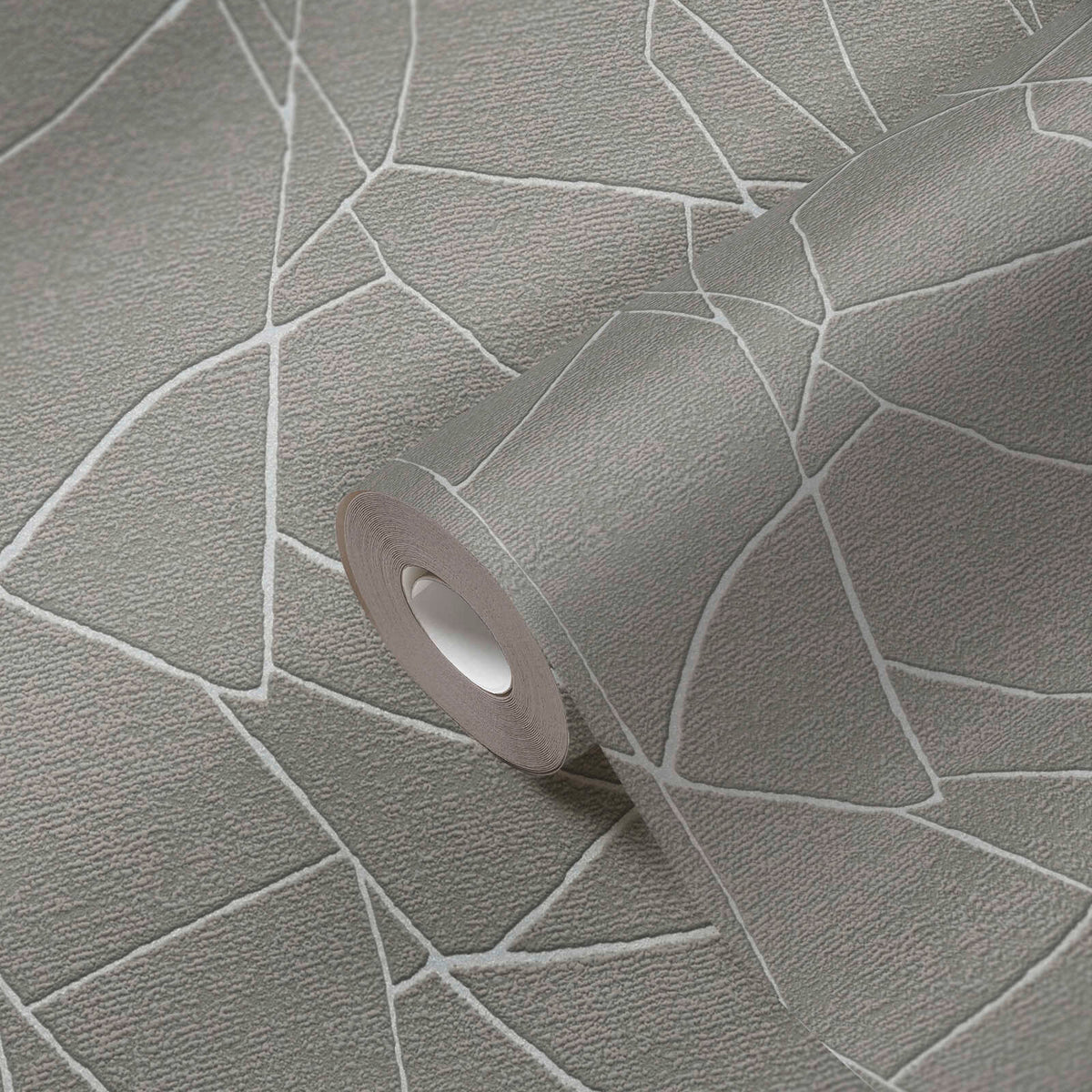 AS Creation French Affair 399343 close up of a wallpaper roll on matching surface showing a grey background with white irregular geometric lines and a textured finish.