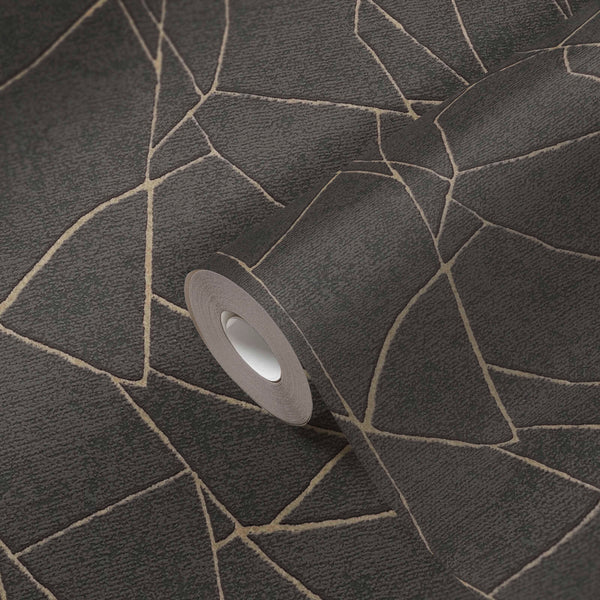 AS Creation French Affair 399344 wallpaper roll resting on an unrolled sheet showing an abstract angular line pattern in Black with Gold Metallic accents.