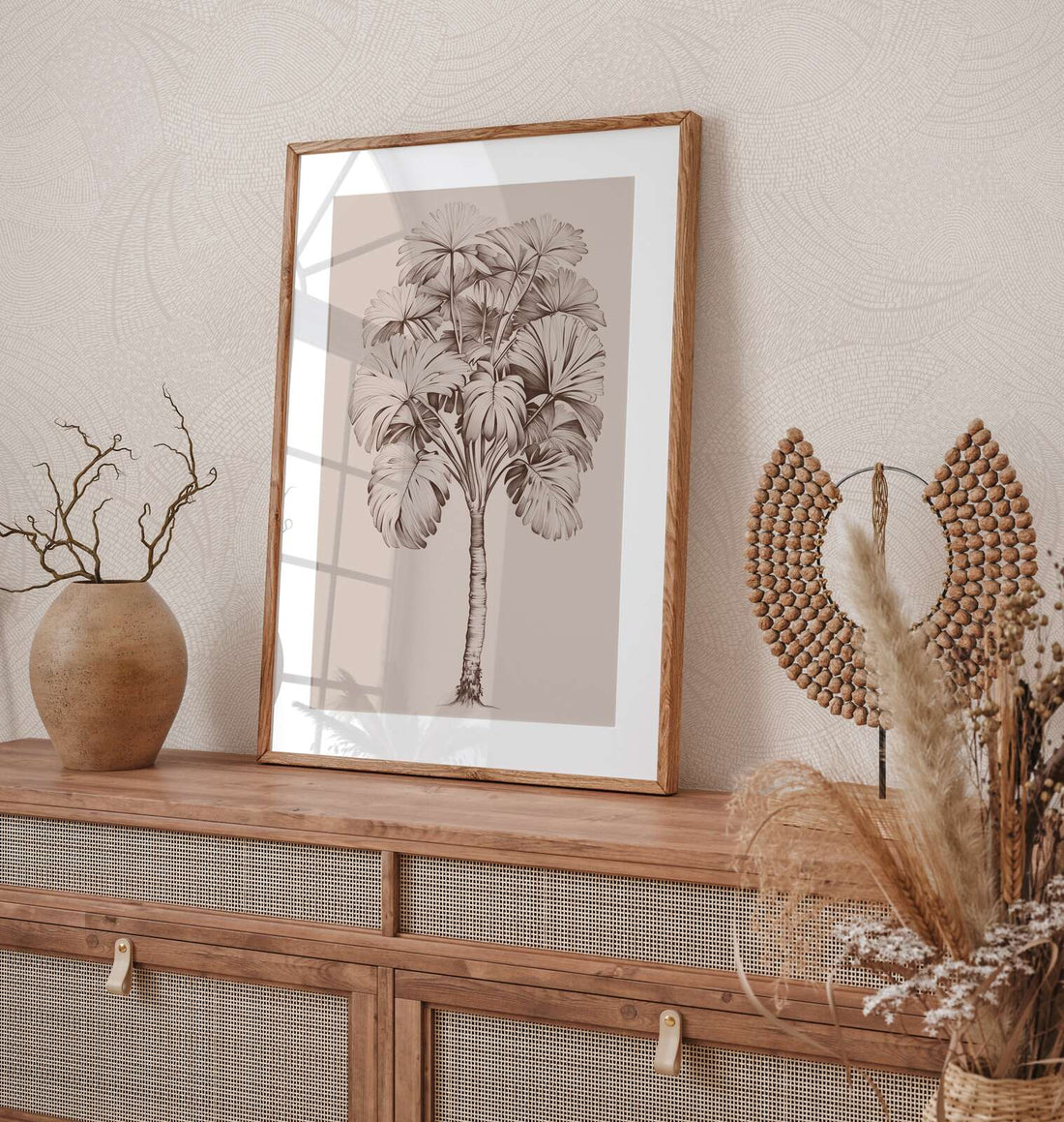 AS Creation French Affair 399351 grey and White wallpaper with a delicate curved line pattern behind a wooden console, framed botanical art, a ceramic vase, and a beaded decor piece.
