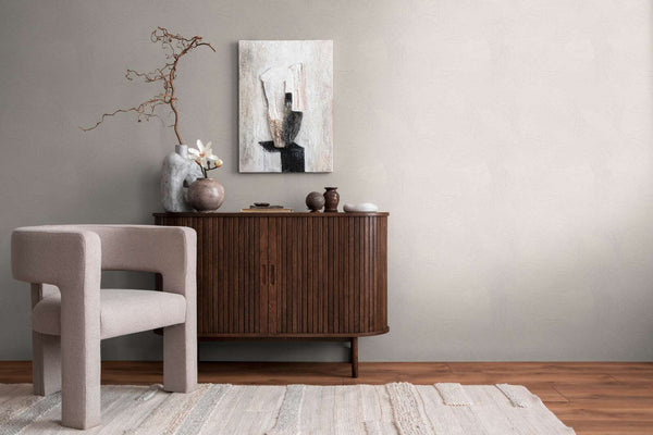 AS Creation French Affair 399351 living room with Grey and White wallpaper featuring a subtle abstract pattern behind a wooden sideboard and an upholstered chair.