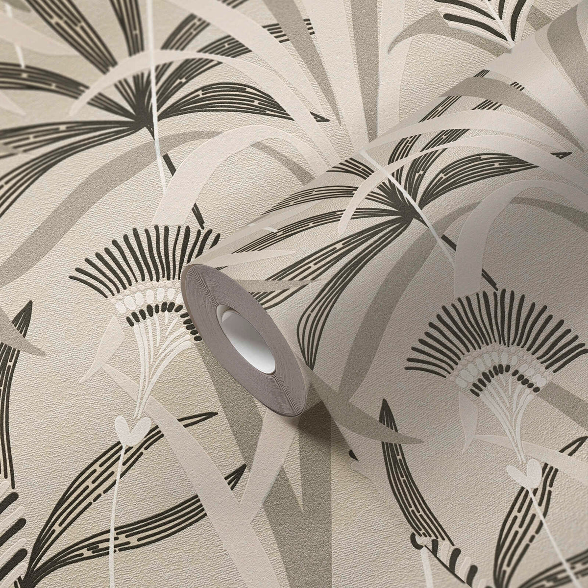 AS Creation French Affair 399361 close up of a wallpaper roll showing a stylized botanical pattern with sweeping leaves and fan like blooms in Beige, Black, Grey, Taupe, and White.