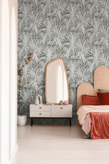 AS Creation French Affair 399362 bedroom with botanical wallpaper in Black, Grey, Turquoise, and White, behind a bed and a dresser.