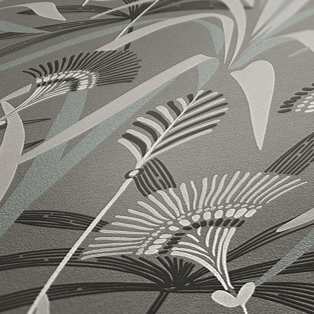 AS Creation French Affair 399362 close up of wallpaper showing stylized botanical fronds and leaves in Black, Grey, Turquoise, and White with a lightly textured, embossed surface.