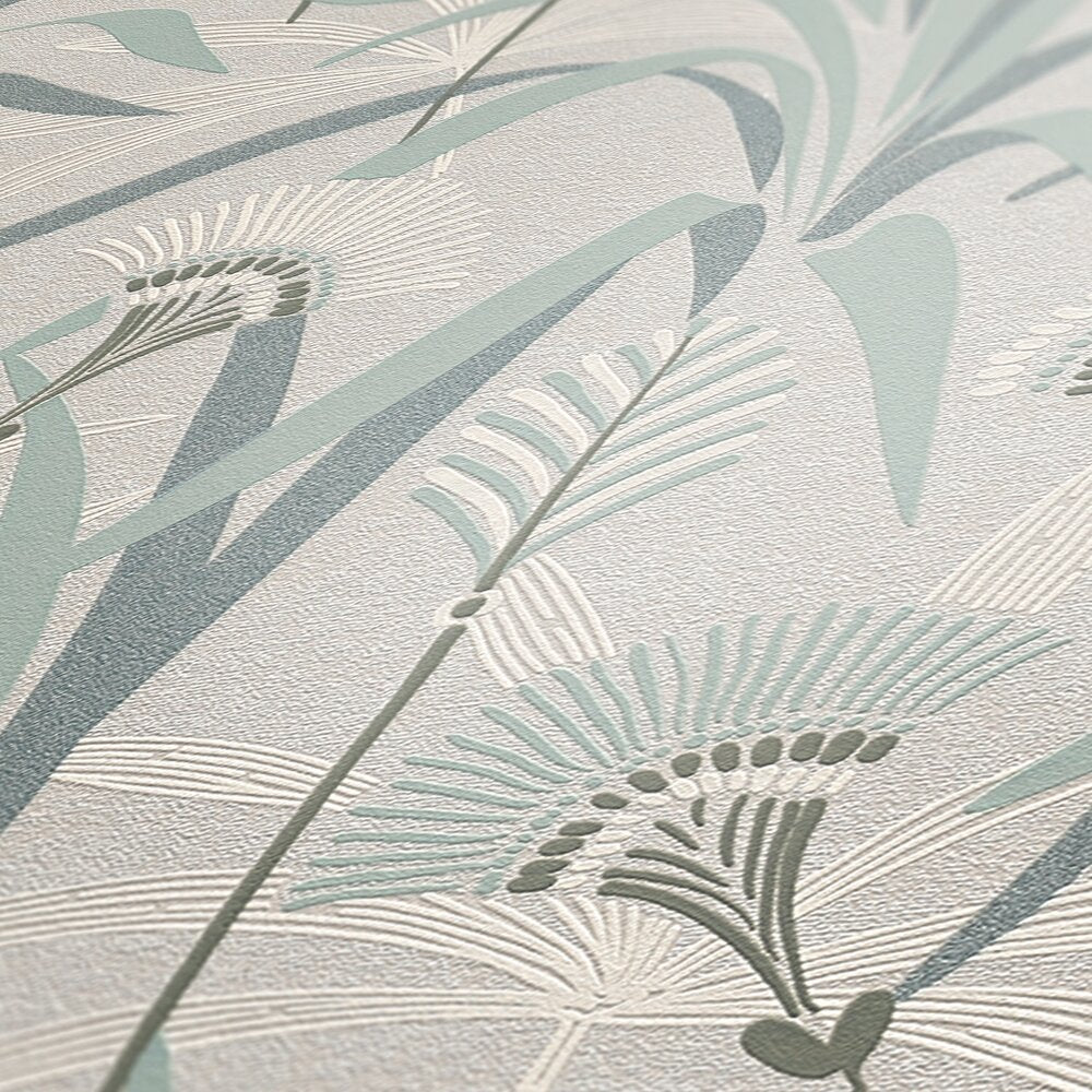 AS Creation French Affair 399363 close up of embossed botanical wallpaper showing stylized leaves and fronds in Green, Grey, Turquoise, and White.
