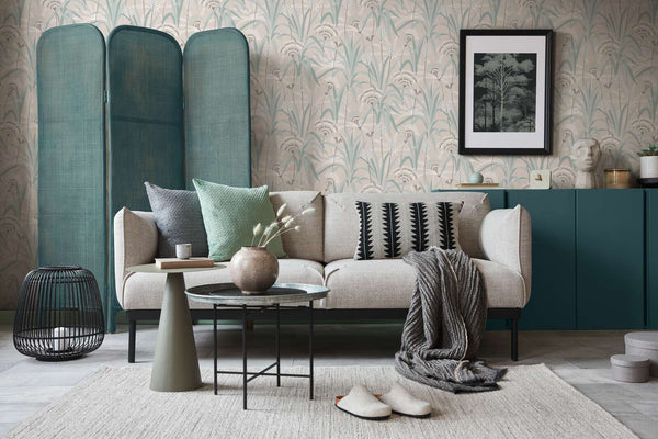 AS Creation French Affair 399363 living room with Green, Grey, Turquoise, and White wallpaper behind a sofa and a coffee table.