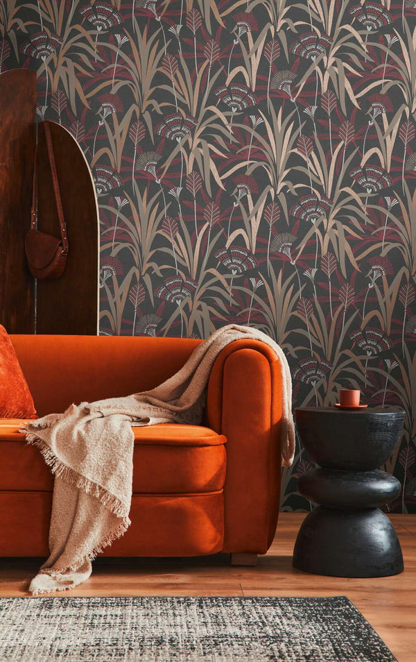 AS Creation French Affair 399364 living room with botanical wallpaper behind a sofa and a side table.