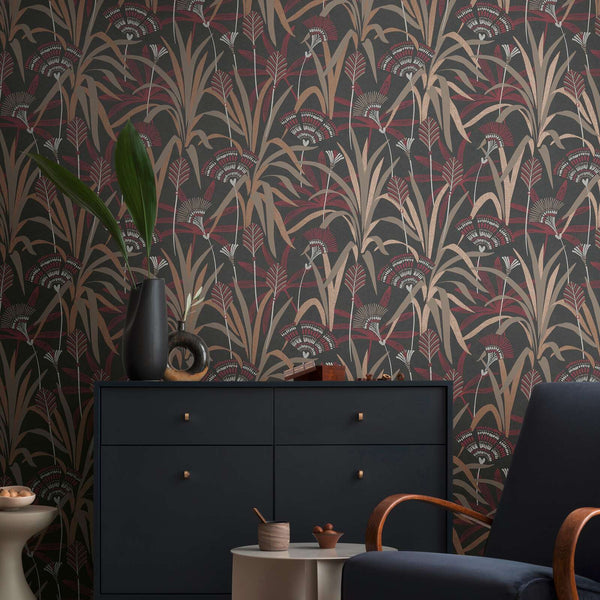 AS Creation French Affair 399364 living room with botanical wallpaper in Beige, Black, Copper, Cream, and Red, shown with a dark sideboard and an armchair.