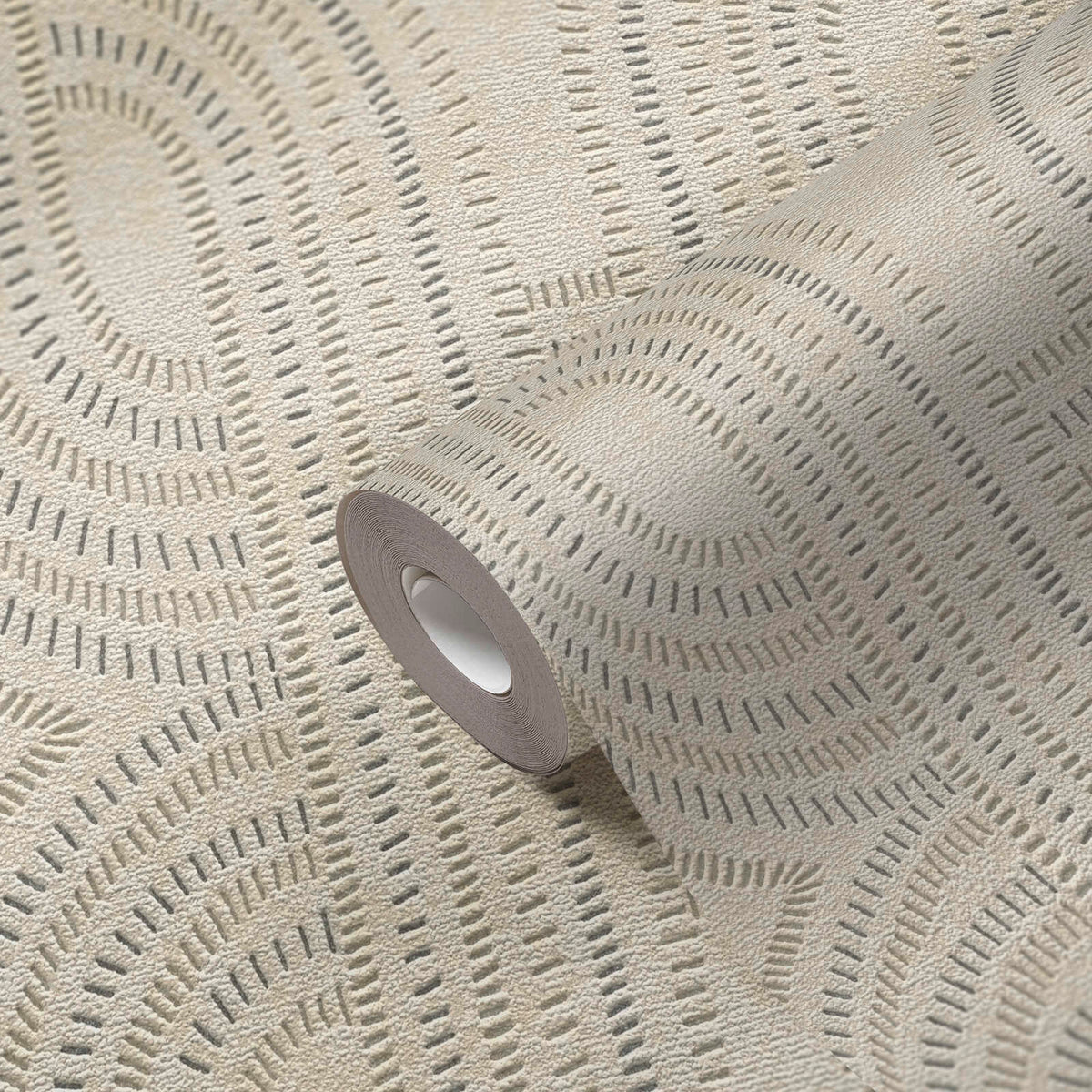 AS Creation French Affair 399371 wallpaper roll on matching surface showing geometric arc motifs made of short dashes with a textured finish in Beige, Gold, Grey, Metallic.