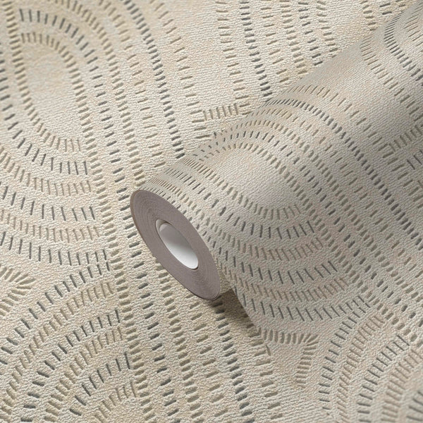 AS Creation French Affair 399371 wallpaper roll on matching surface showing geometric arc motifs made of short dashes with a textured finish in Beige, Gold, Grey, Metallic.