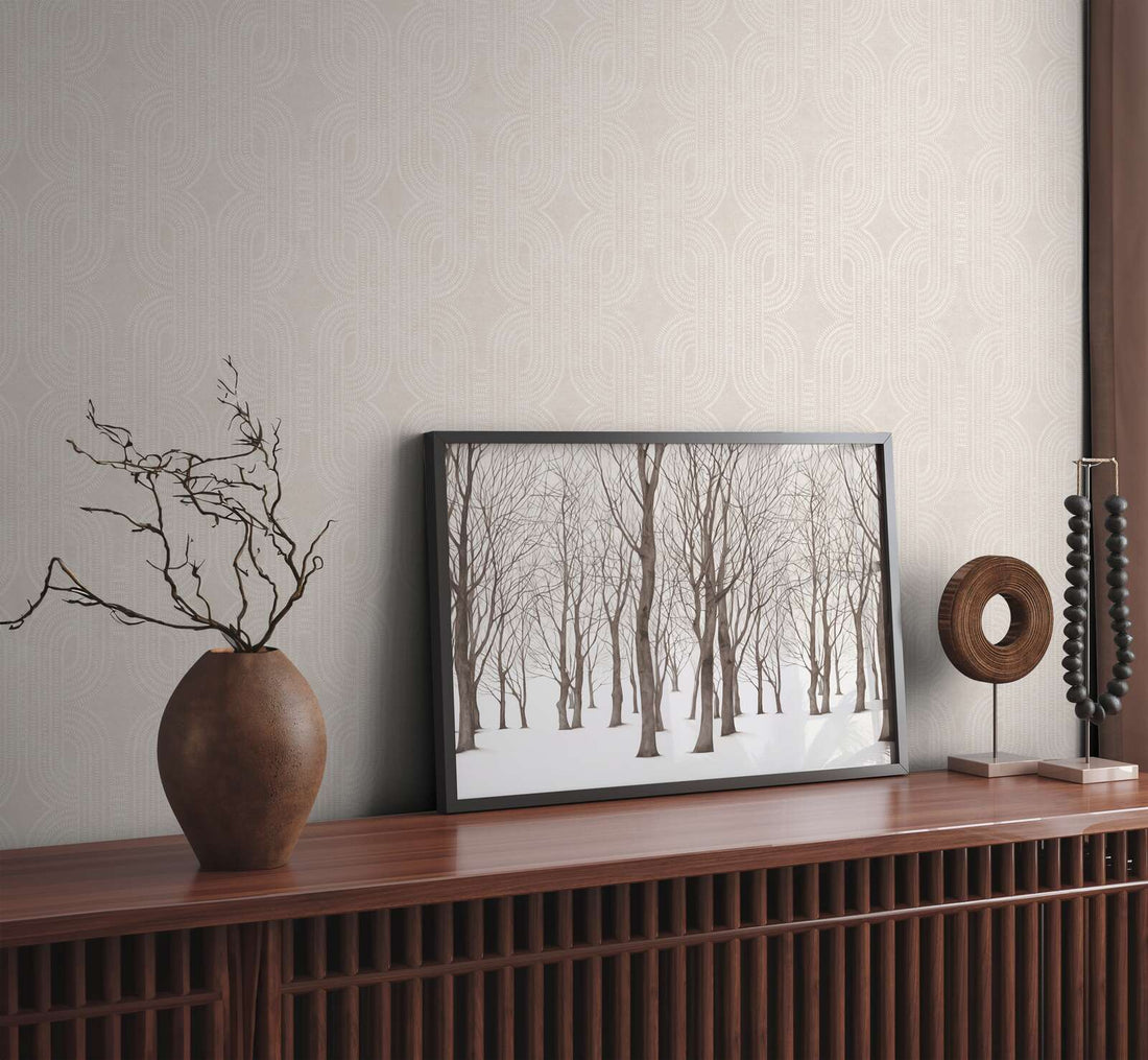 AS Creation French Affair 399372 grey and White geometric wallpaper behind a wooden console with a framed forest print and a ceramic vase.