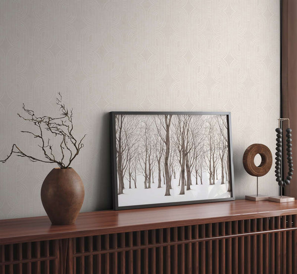 AS Creation French Affair 399372 grey and White geometric wallpaper behind a wooden console with a framed forest print and a ceramic vase.