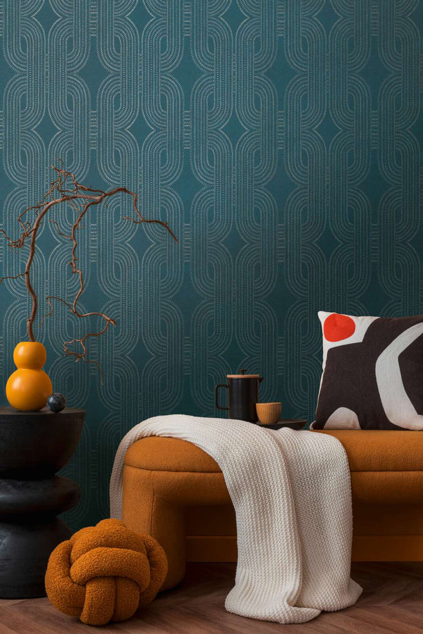 AS Creation French Affair 399373 living room with geometric patterned wallpaper behind a bench and a side table.