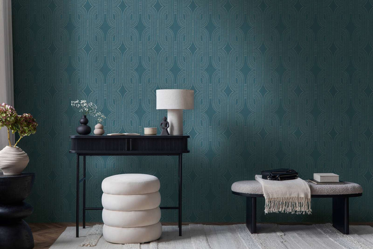 AS Creation French Affair 399373 office scene with geometric wallpaper behind a black desk and an upholstered bench.