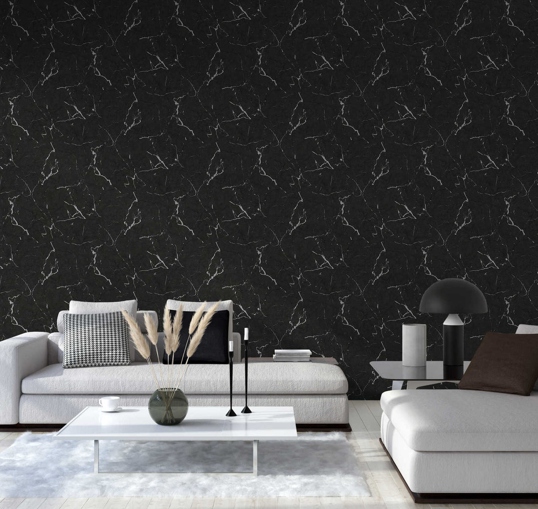 AS Creation Metropolitan Stories Ii 378552 living room with Black, Grey, Metallic marble vein wallpaper behind modern sofas and a low coffee table.