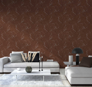 AS Creation Metropolitan Stories Ii 378553 living room with brown, metallic veined wallpaper behind a sofa and a low coffee table.