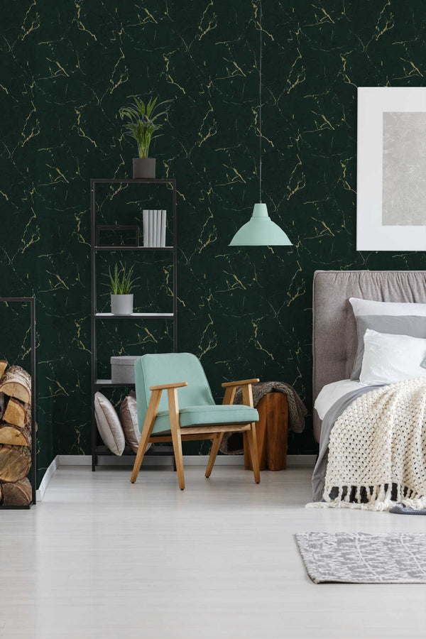 AS Creation Metropolitan Stories Ii 378555 bedroom with green wallpaper with metallic veining, shown behind a bed and an armchair.