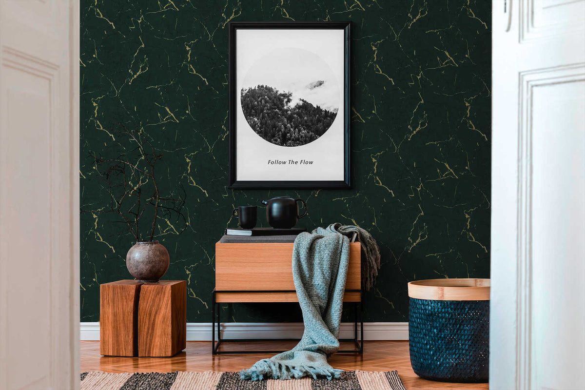 AS Creation Metropolitan Stories Ii 378555 living room with Green, Metallic wallpaper featuring marble like veining behind a framed wall art and a wooden console.