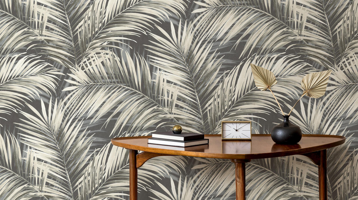 Styled vignette with large palm frond wallpaper from the Erismann Cameo collection.