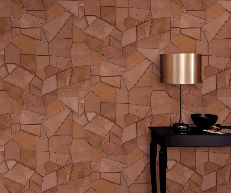 Erismann Elle Decoration 4 terracotta geometric wallpaper with textured panels and structured design behind a black simple side table