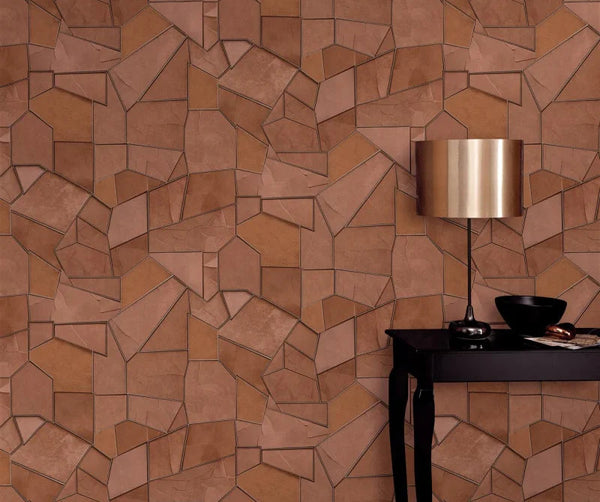 Erismann Elle Decoration 4 terracotta geometric wallpaper with textured panels and structured design behind a black simple side table